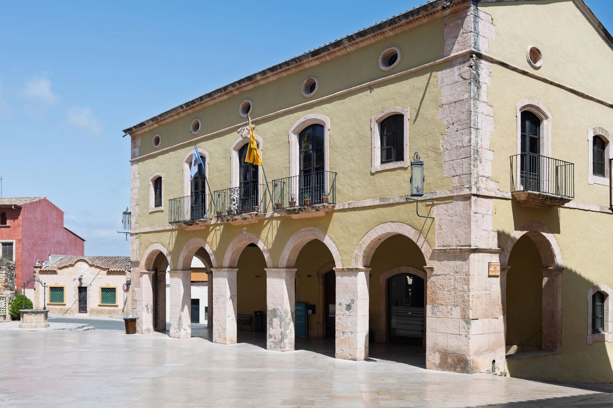 Historic town hall building with arches
